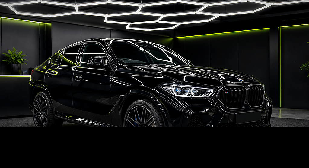 BMW X6M Competition black side angle rental car