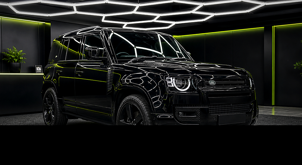 Range Rover Defender black side angle rental car