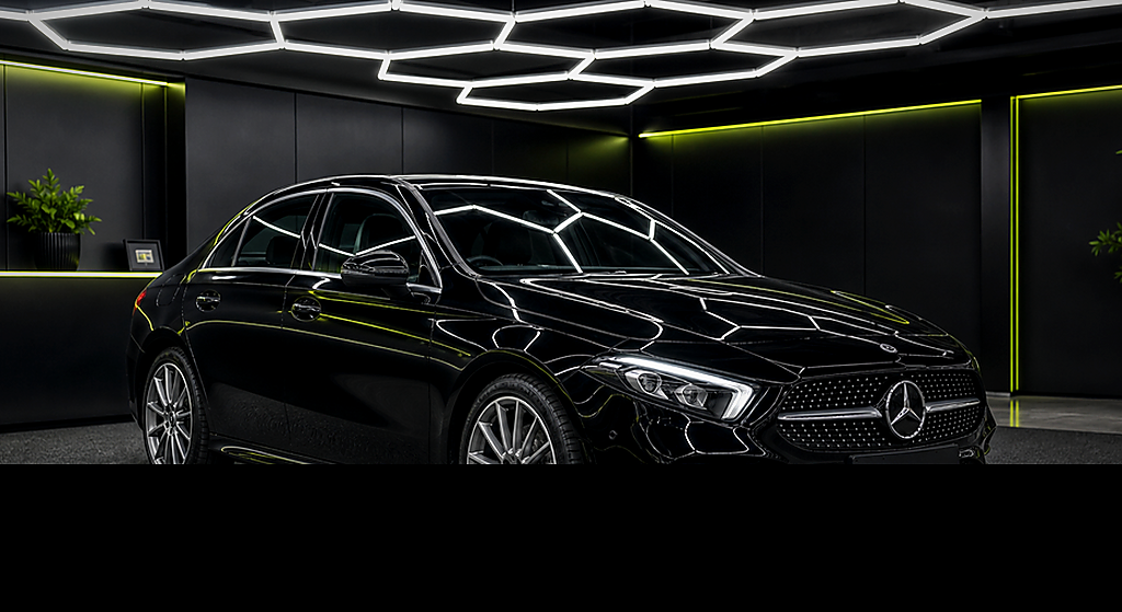 Mercedes Benz A180d Saloon black side angle rental car