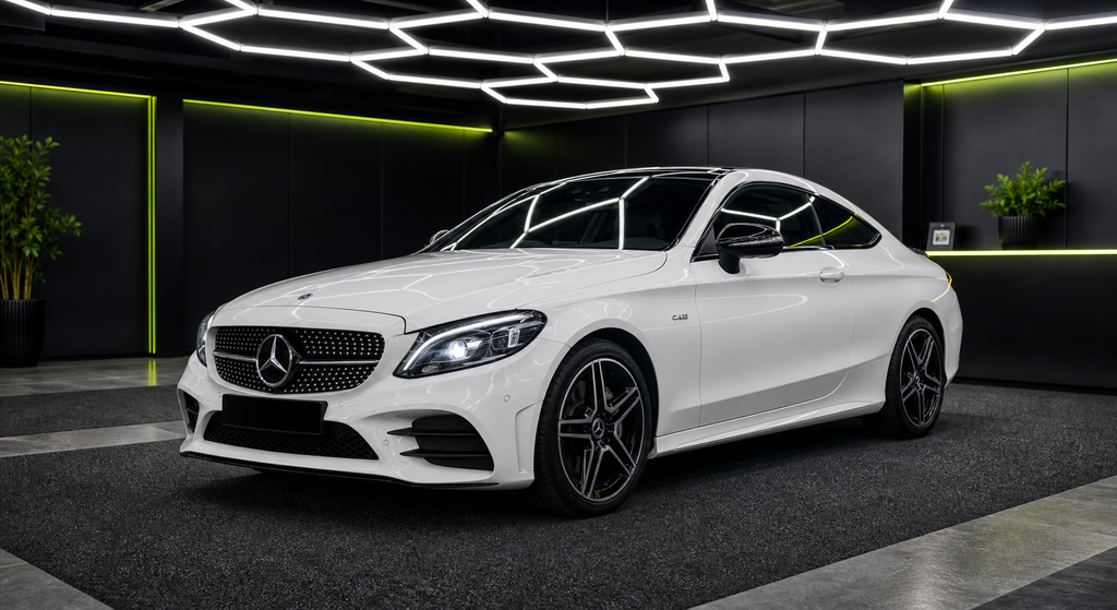 Mercedes Benz C43 AMG white rental car in the Wrapidautos showroom