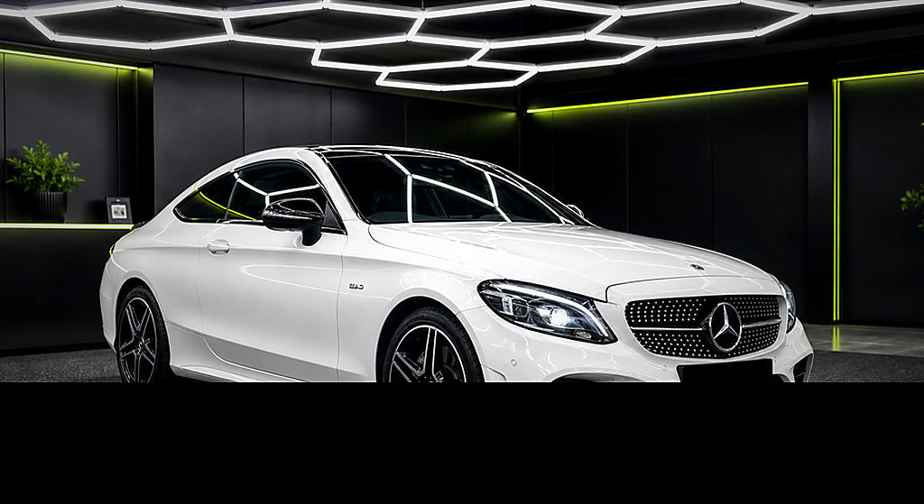 Mercedes Benz C43 AMG white side angle rental car