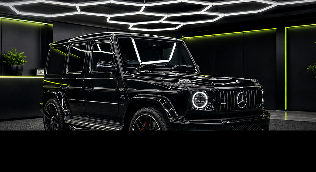 Mercedes Benz G WAGON - 4 MATIC black side angle rental car