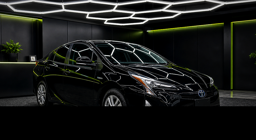 Toyota Prius black side angle rental car
